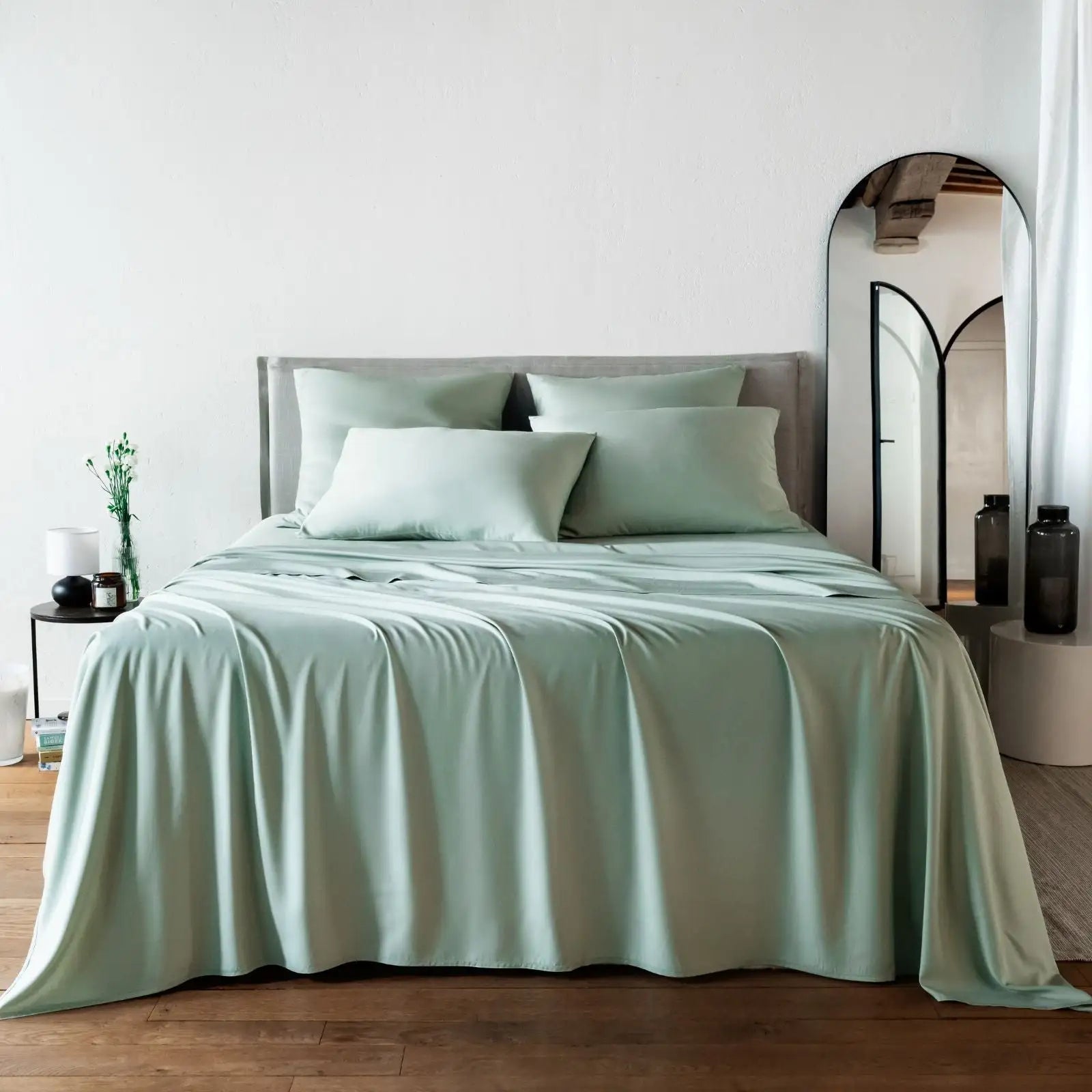 Bed with light green bambaw cozy bamboo bedding in a bedroom setting