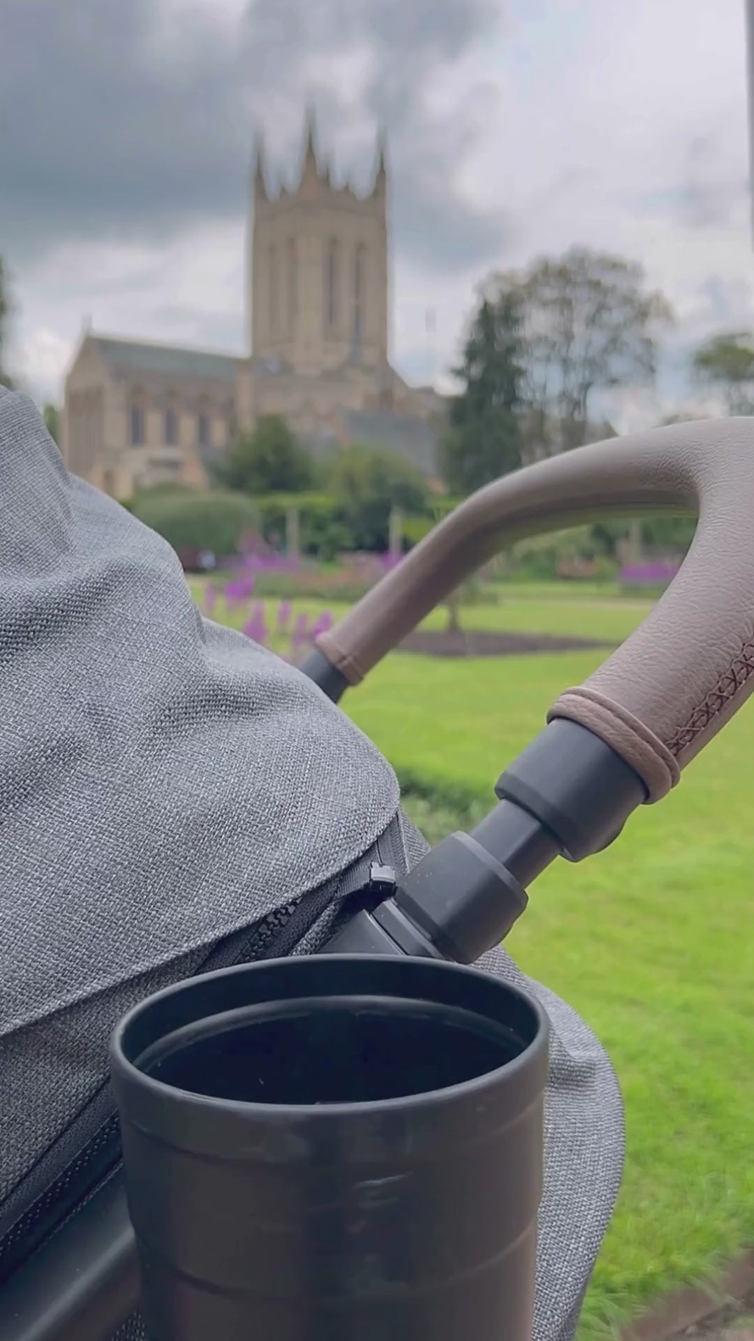 stainless steel water bottle in a use by a mother with a baby in the park